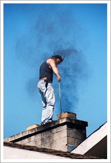 Young man cleaning the chimney||||