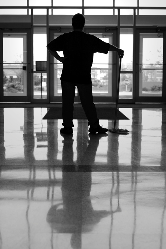 Man reflecting in clean floor||||