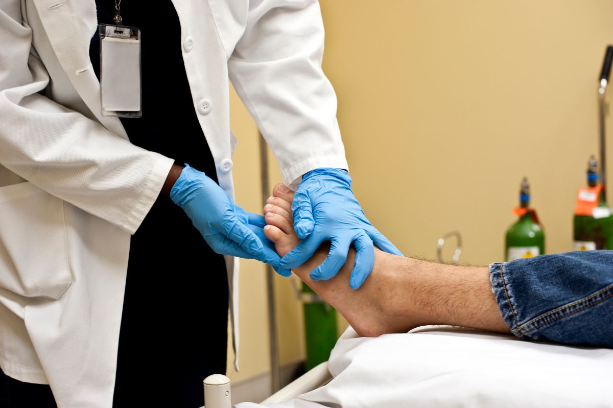 Checking the patient's foot