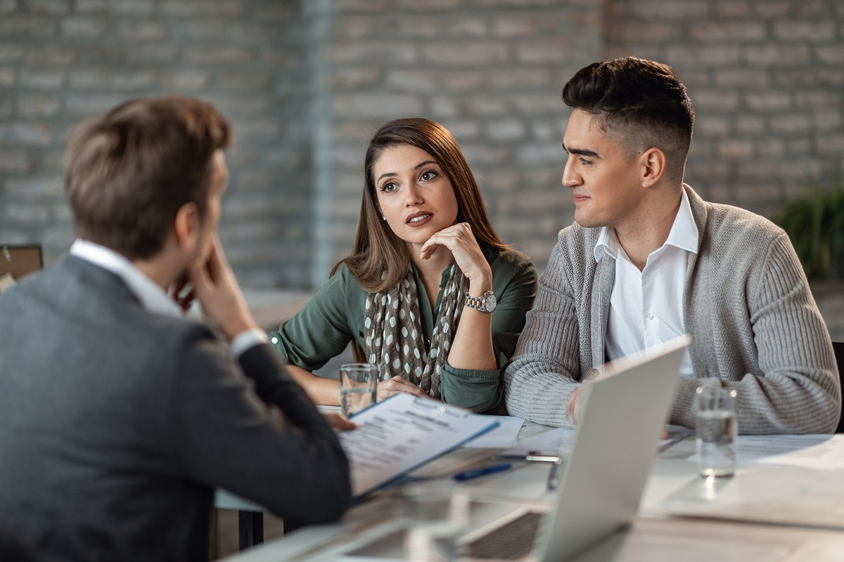 Couple consulting with attorney Couple consulting with attorney