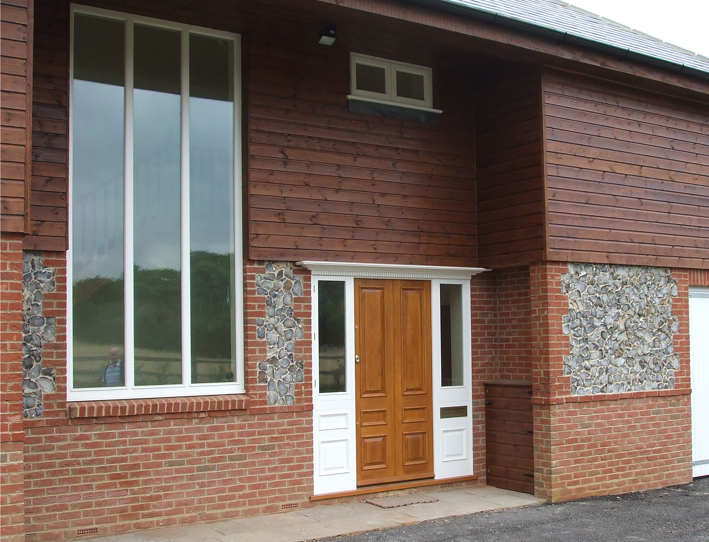 a room with a table chairs and a lamp