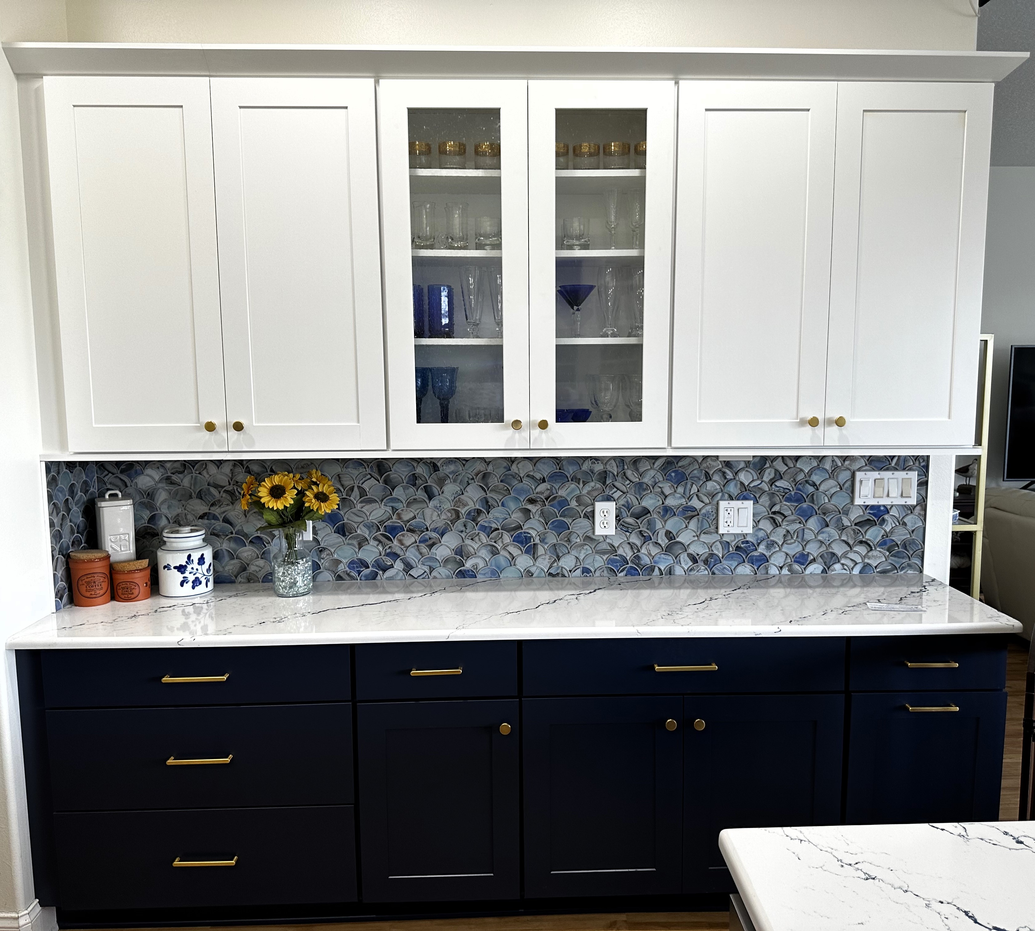 The beautiful Cambria Inverness Cobalt quartz countertops and backsplash create a pop of elegant color.