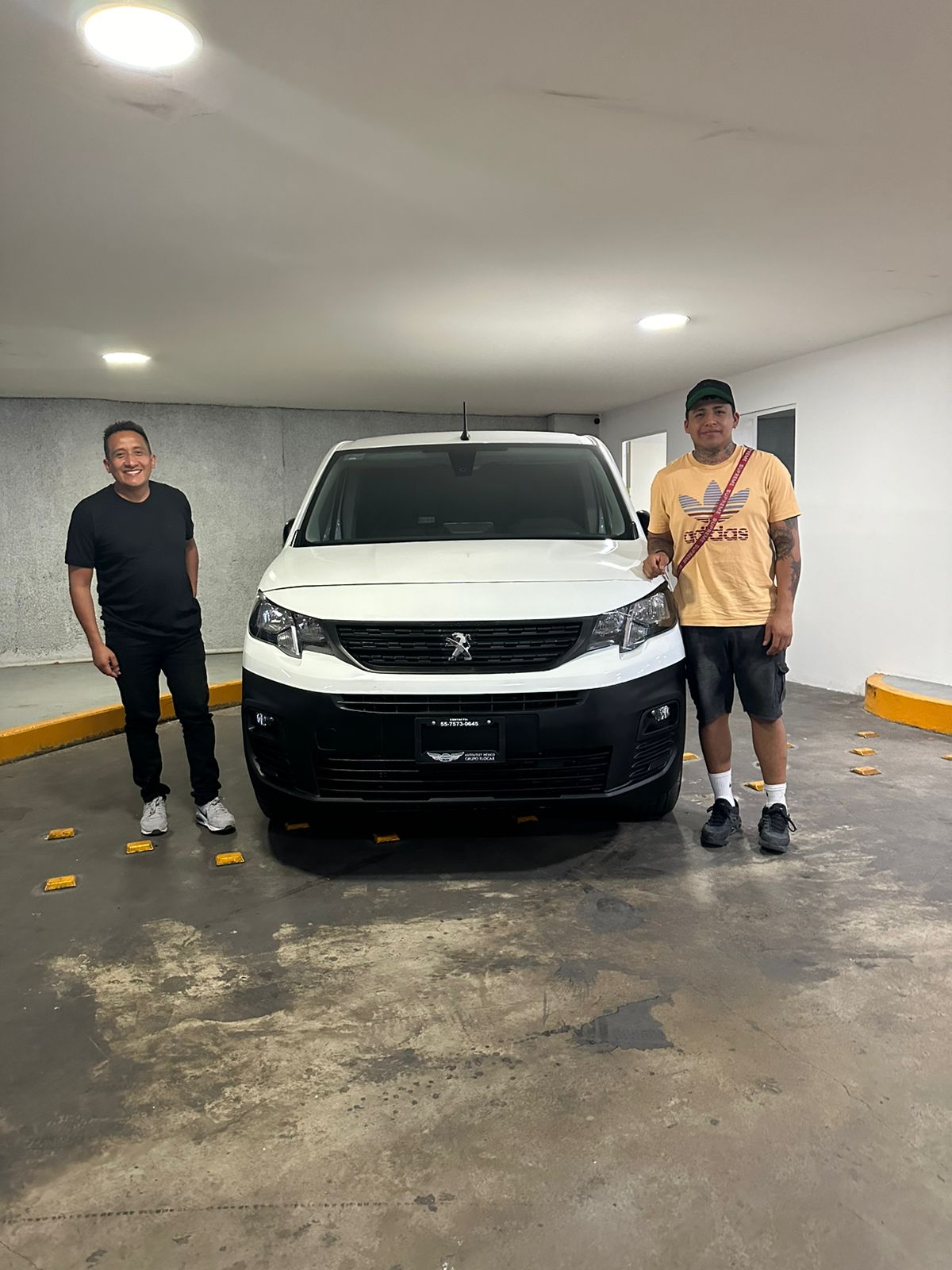 a woman in a black jacket is sitting down