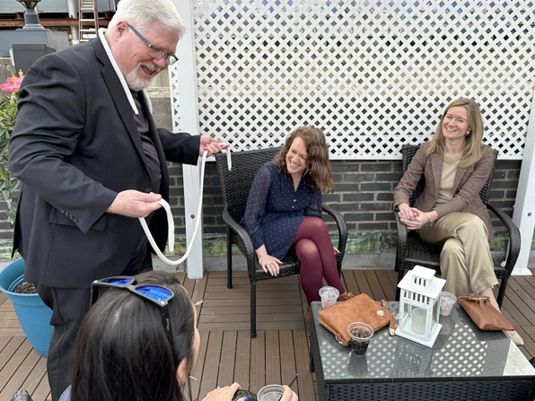 Entertaining guests at a rooftop party.