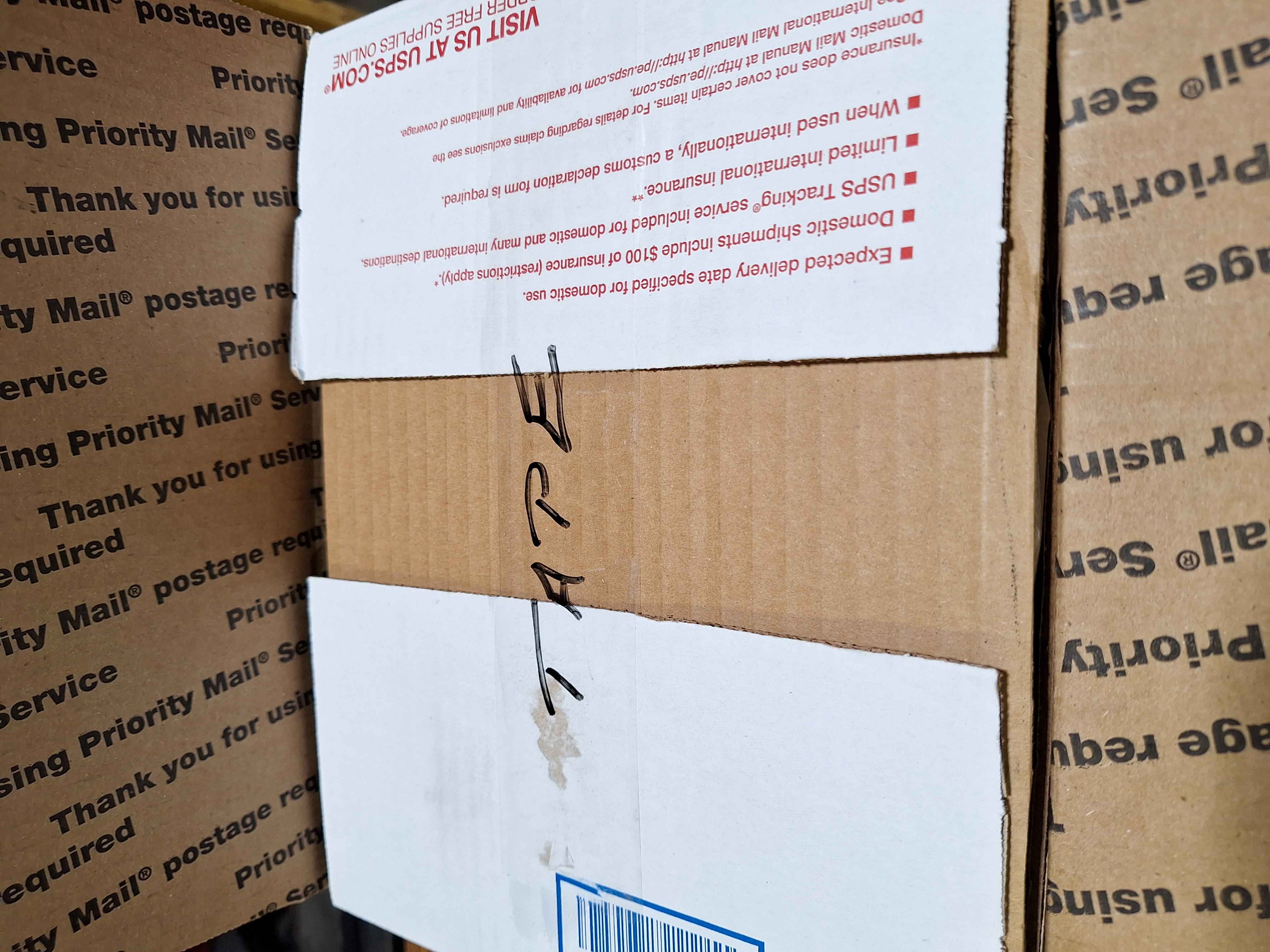 Securing top side flaps with tape.