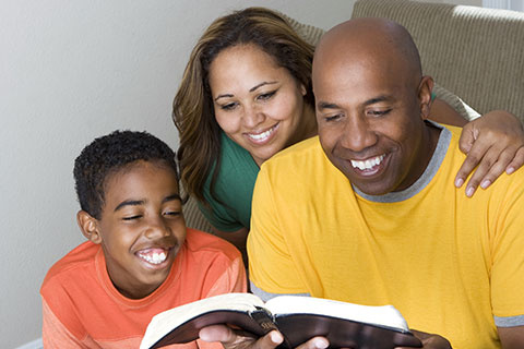 Family Reading The Bible.