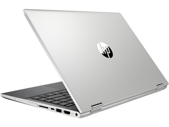 Portátil HP plateado con logo visible desde atrás, mostrando puertos laterales.