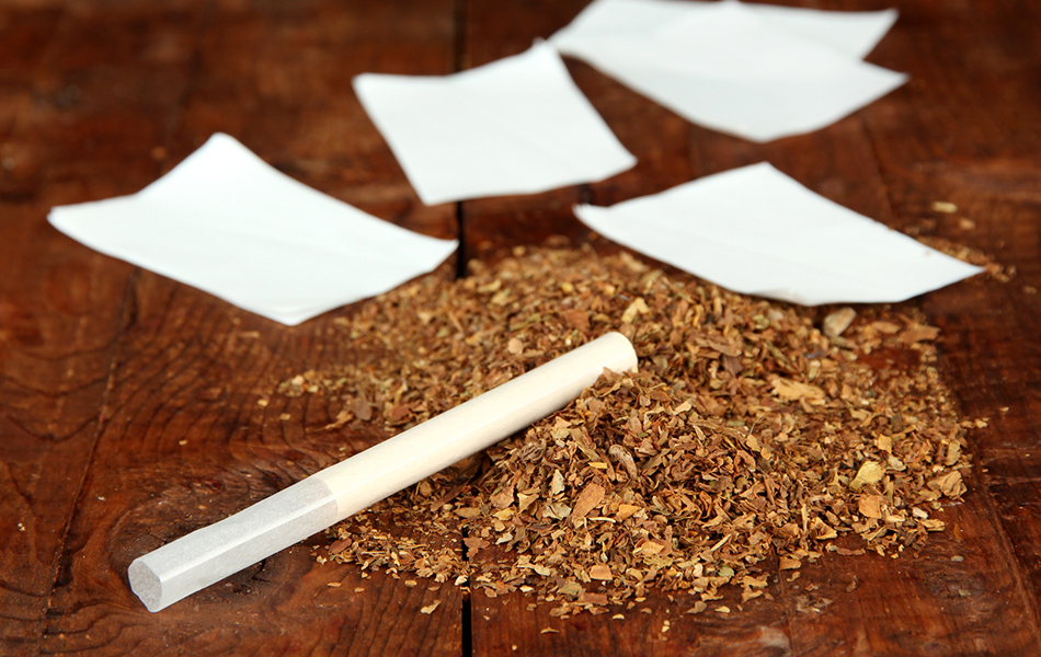 Tobacco And Rolling Paper, On Wooden Background