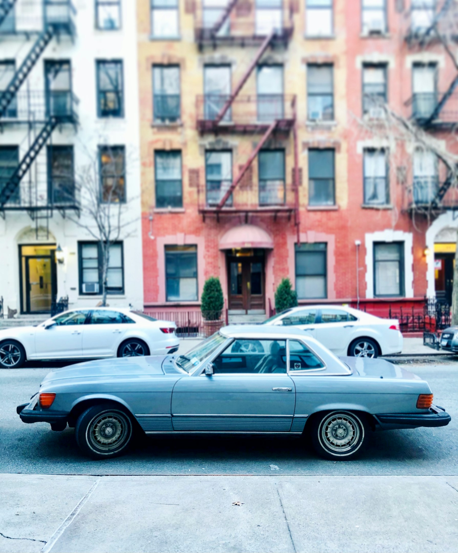 silver sedan on road during daytime