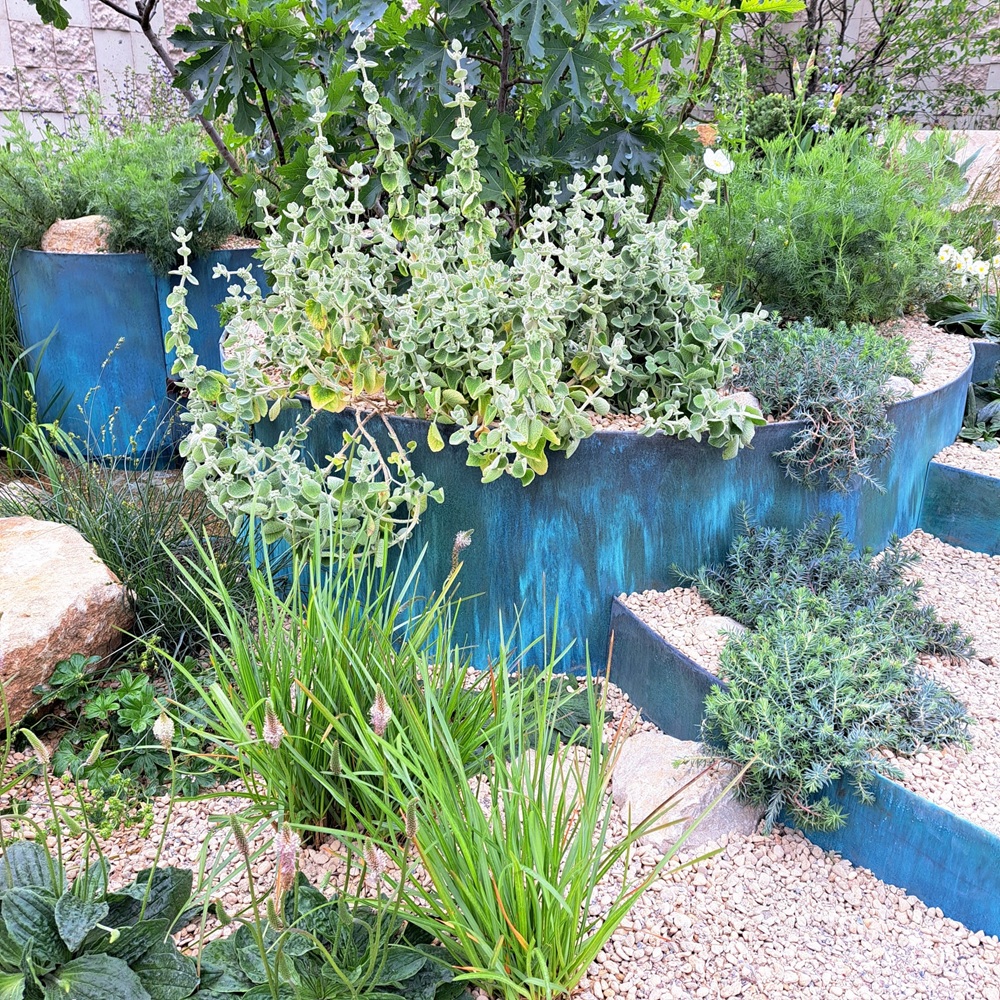 Verdigris finish on the water feature and edging throughout the garden for Addleshaw Goddard, Flourish in the City garden.