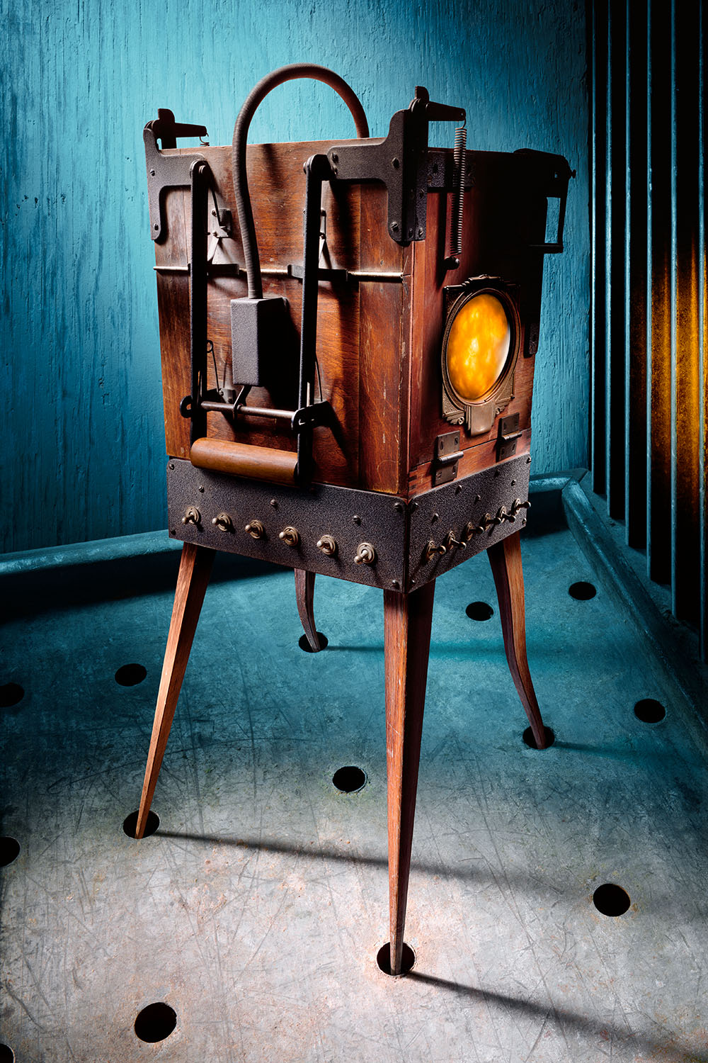 A fantastical machine, comprised of weathered wood and metal, with a multitude of switches, springs, and mechanisms.