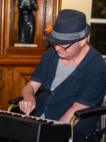 May be an image of hat and piano