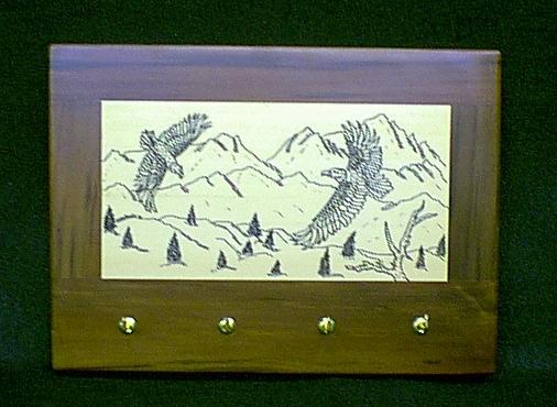 Hand engraved eagles on a red and yellow cedar laminated plaque, not a cheap laser imitation... $75  Sold, I can always make another...