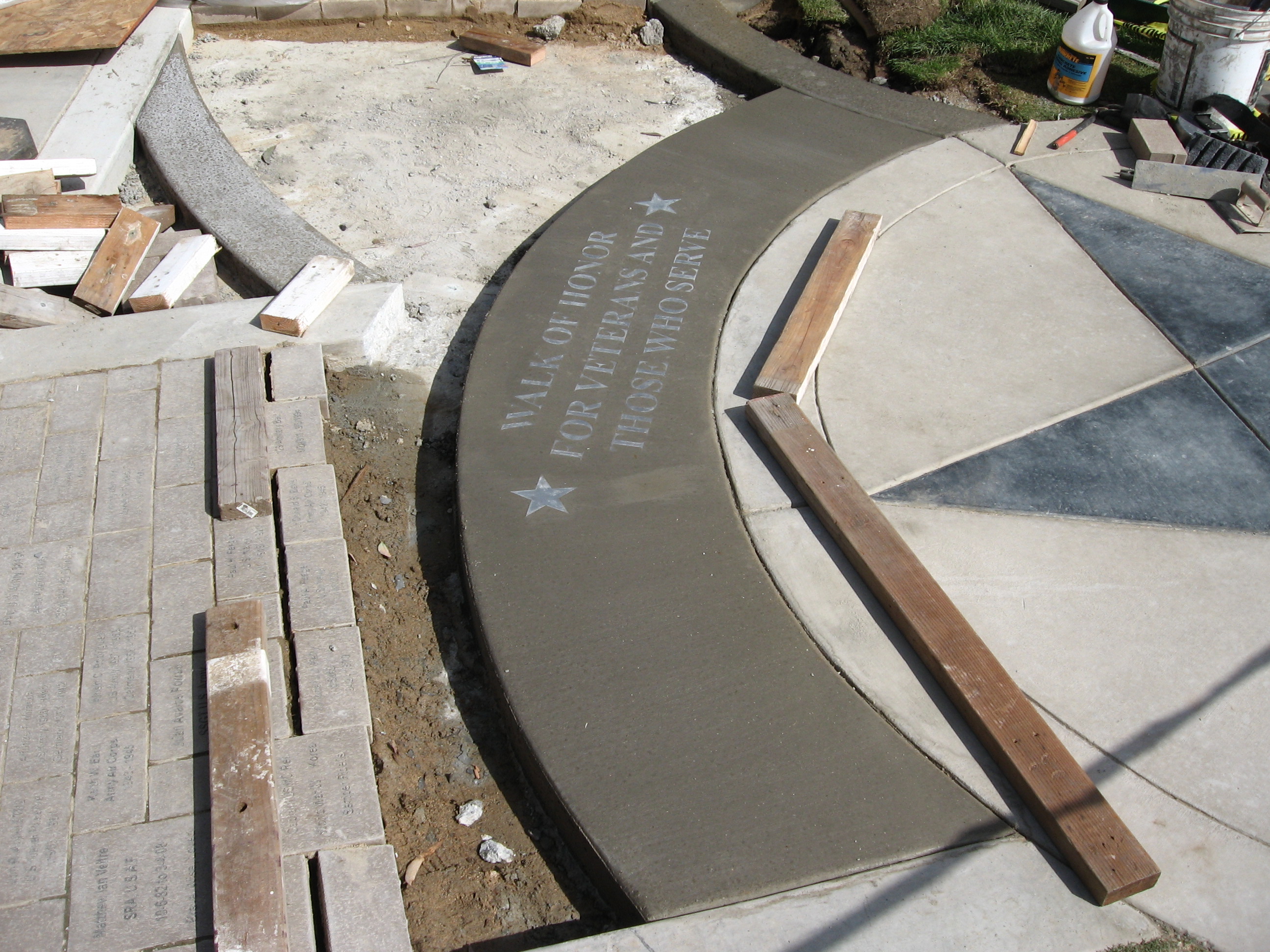 Concrete pattern with Stainless Lettering