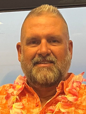 A man in an orange shirt