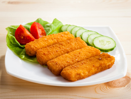 Fish Sticks with Vegetables on a White Plate