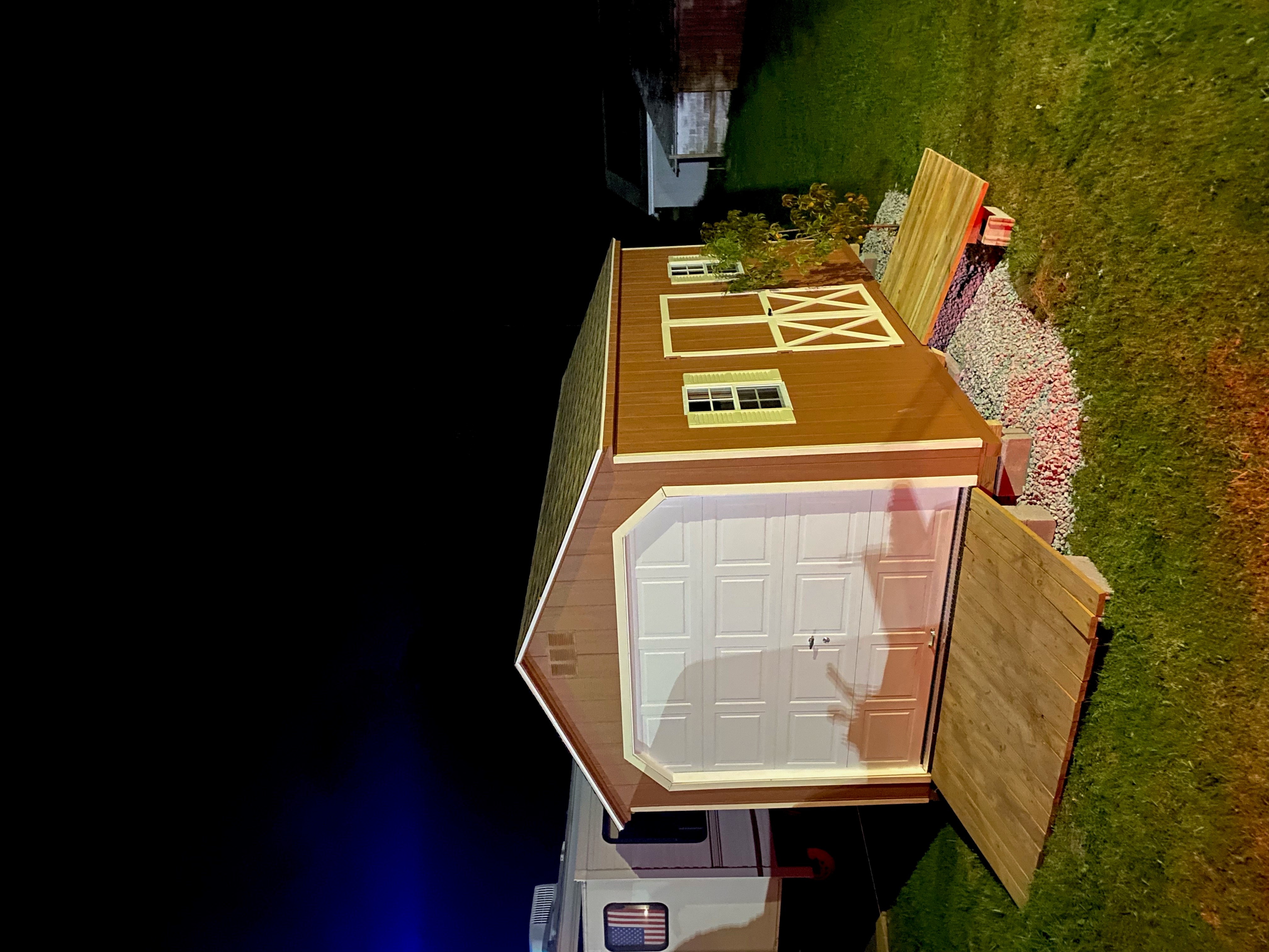 Look at this gorgeous 10 x 16 A-Frame Garage in wood featuring: chestnut T-111 siding, with Navajo trim, and 30 year architectural shingles with tarpaper underlayment.  We are also featuring: 2- 18" x 27" slider windows with screens, Navajo louvered shutters, pressure treated floor joists, 1- set of 5' double doors, 1- 8x7 Overhead door, and 1- 5 x 4  & 1- 4 x 8 treated ramps.

Thank you Brenda, we hope you love the new beauty!!