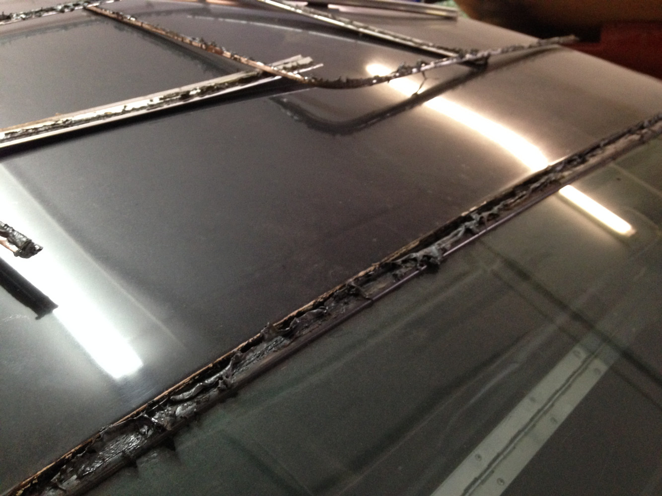 All the sealant must be removed from the window channel
and from the backside of the molding, a weeks worth of work!