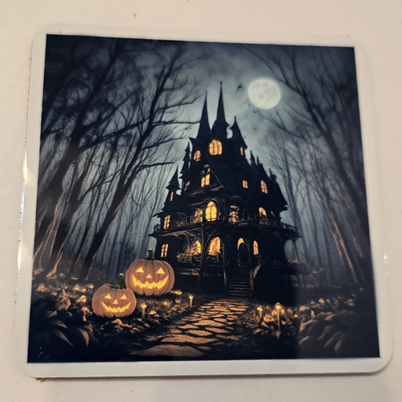 Square metal coaster with a pumpkins at night design