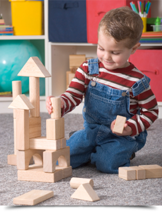 Young boy building toy blocks||||