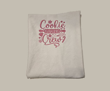 Embroidered cookie baking crew in pink on white youth apron