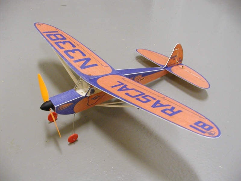 Here is the finished model that was developed using the described process. This is a reproduction of a 1950's kit from Top Flite called  the Rascal 18. It was intended for rubber powered free flight operation. The model shown has an 18" wing span and is equipped with an M-20, 4.2:1 gear drive, single 190 mah Lithium Polymer cell, JMP Combo radio, and two Bob Selman magnetic actuators. Flying weight is 30 grams.