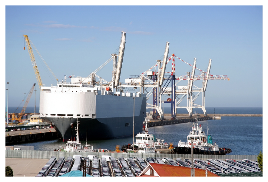 Car carrier in harbor||||