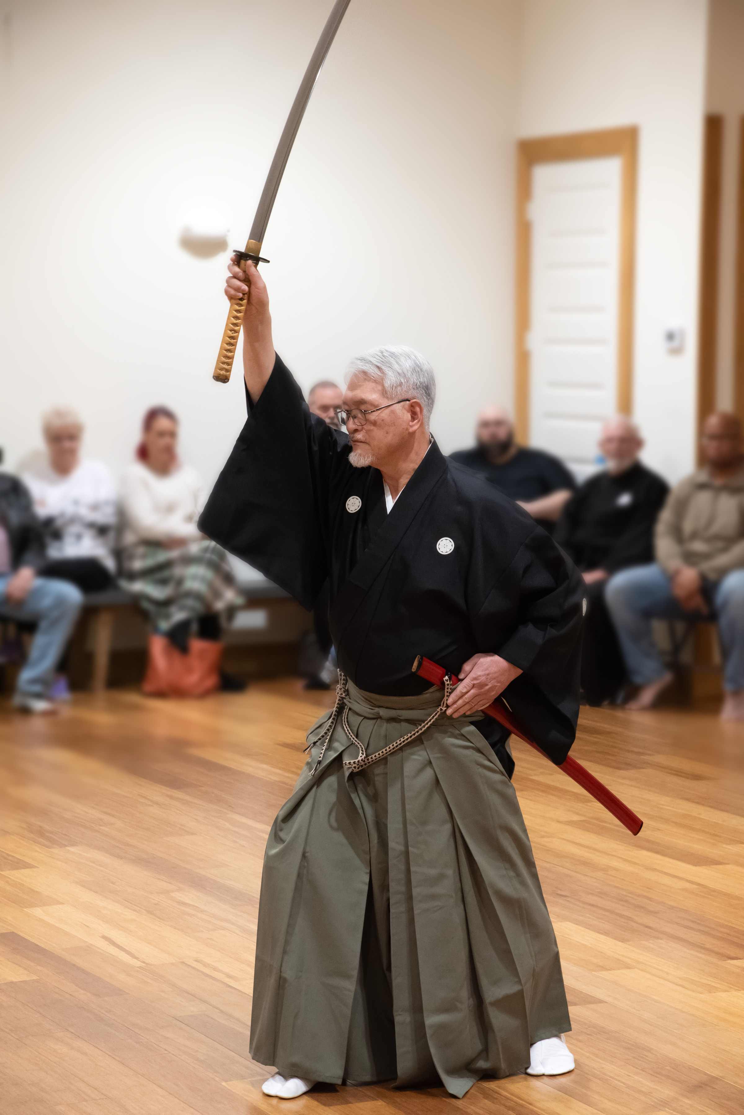 Nomura Sensei performing Shiho Barai - a ritual purification of the dojo.