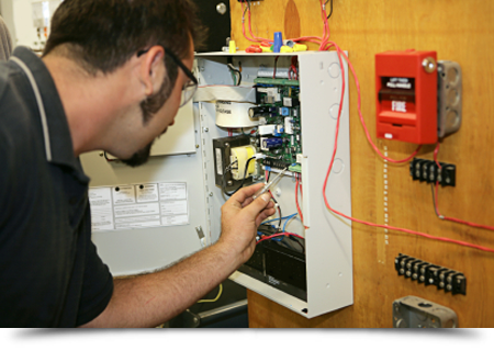 Electrician wiring a fire alarm||||