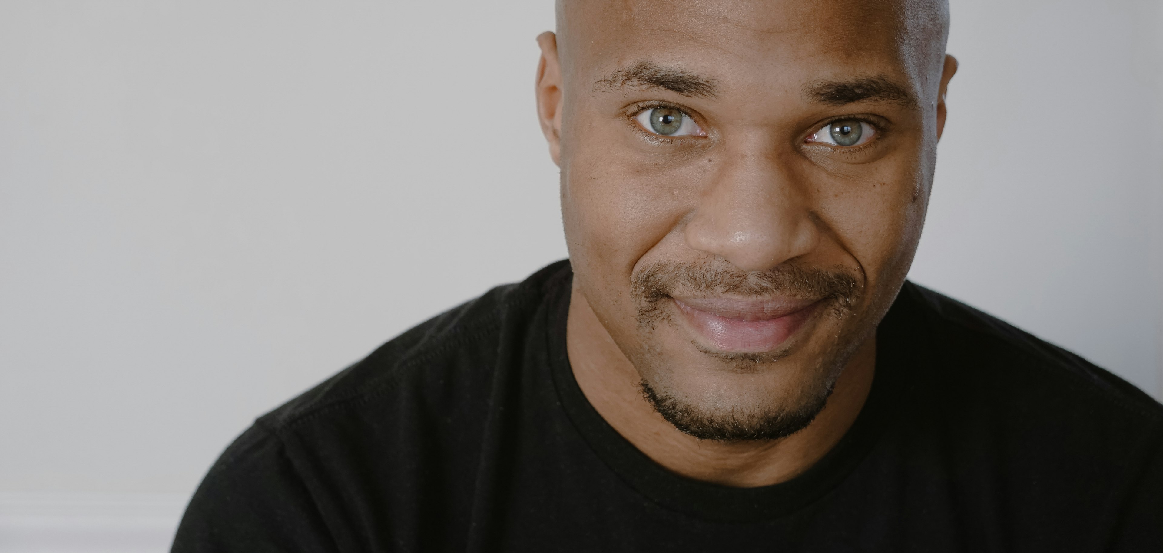 a close up of a person wearing a black shirt