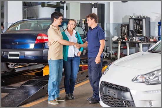 Couple Discussing with Mechanic