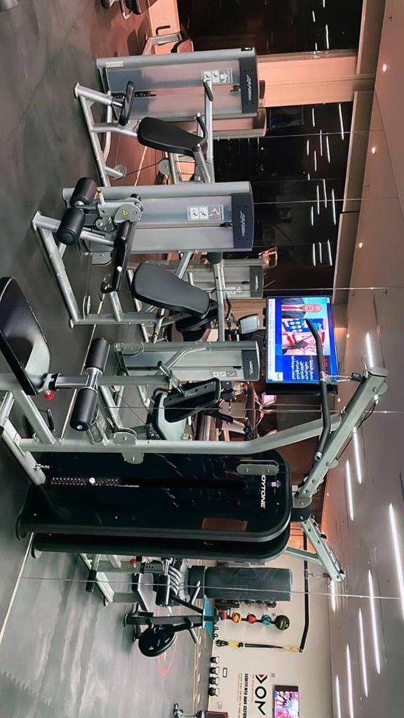 Muscular blond woman in the gym