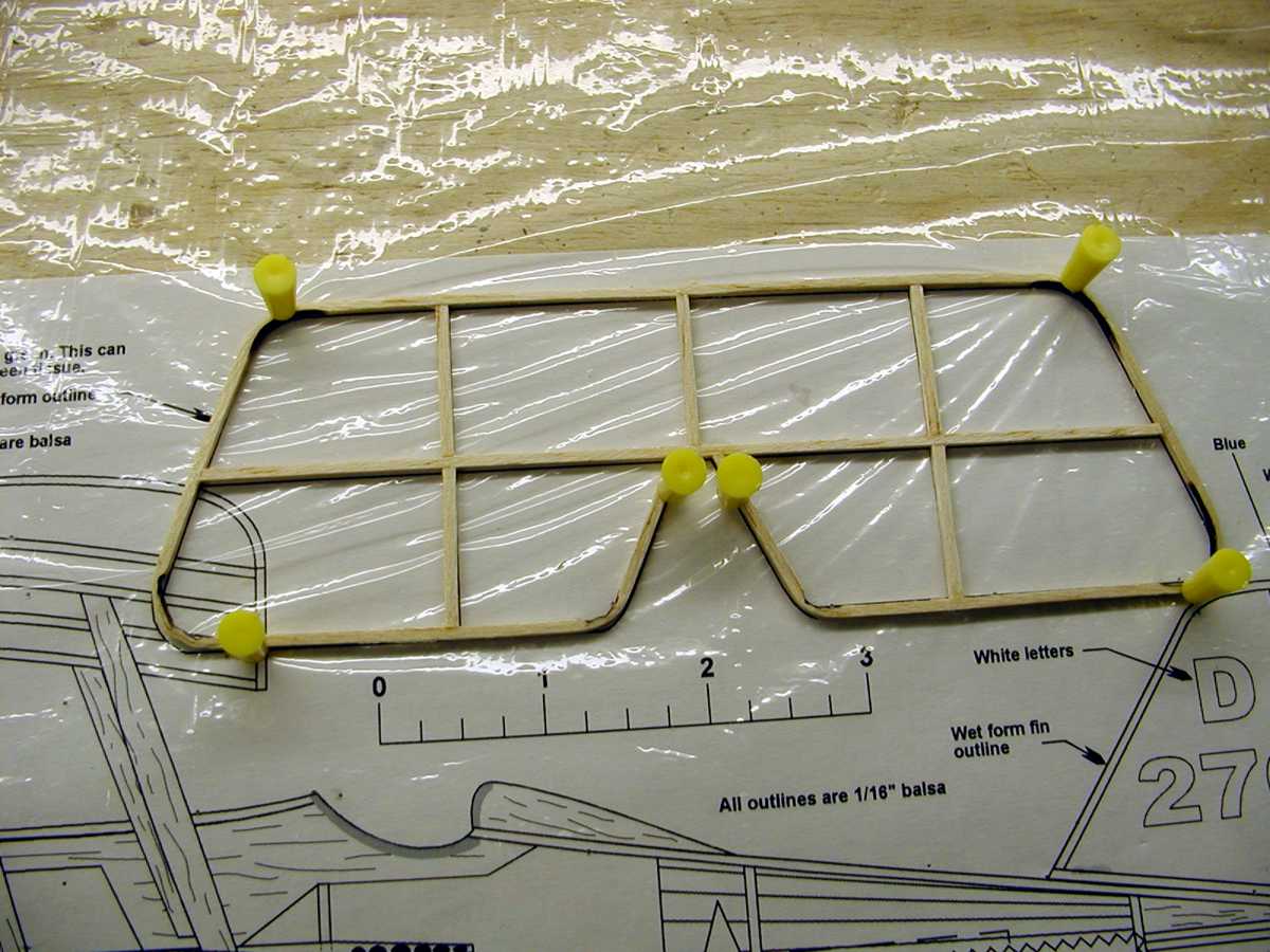 Let the formed wood strip stay on the plan until the wood dries completely. Thirty minutes or so should be enough drying time. Once dry you can final trim the outline and add the internal structural pieces. Again, if you don't like the appearance of the scorched areas, they can be sanded clean when the wood is dry. Most of the time the scorched areas are hidden by the model's covering.