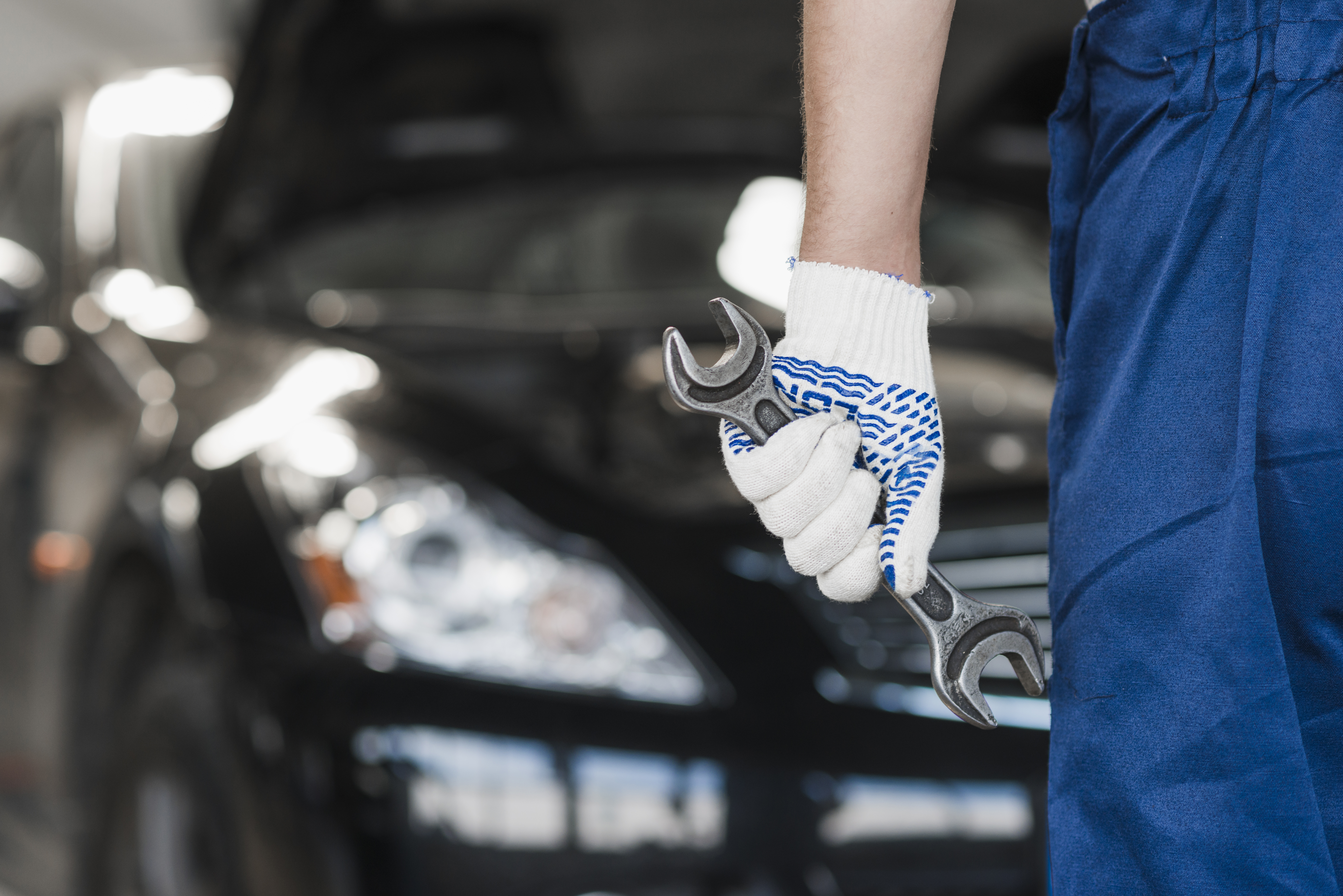 Hands over a car model