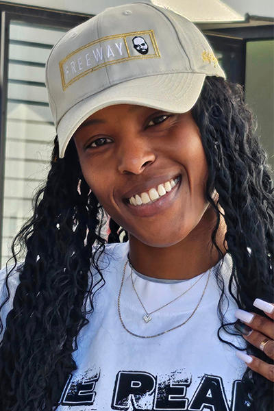 Woman wearing a Rick Ross cap