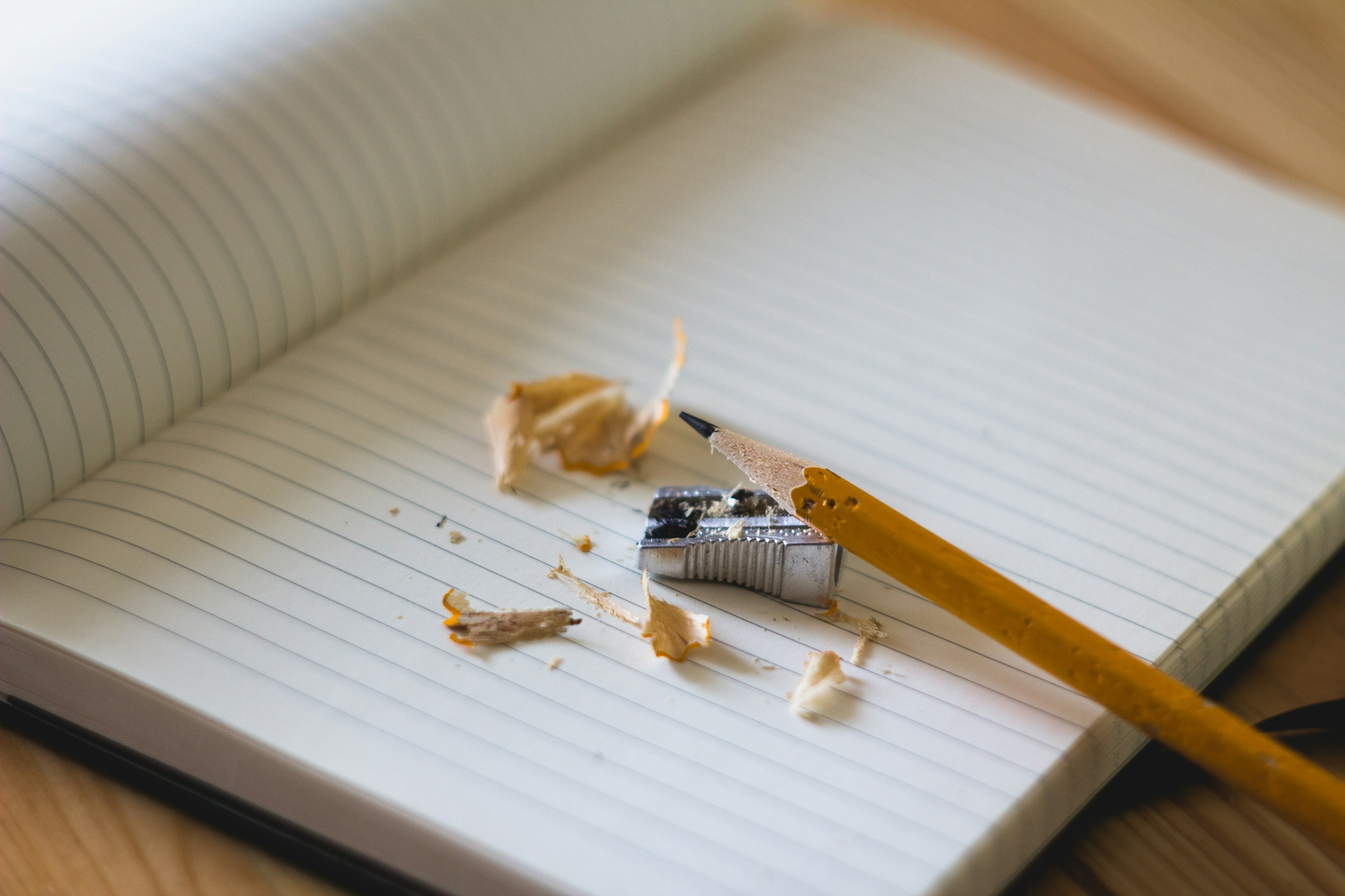 pencil and sharpener on notebook page
