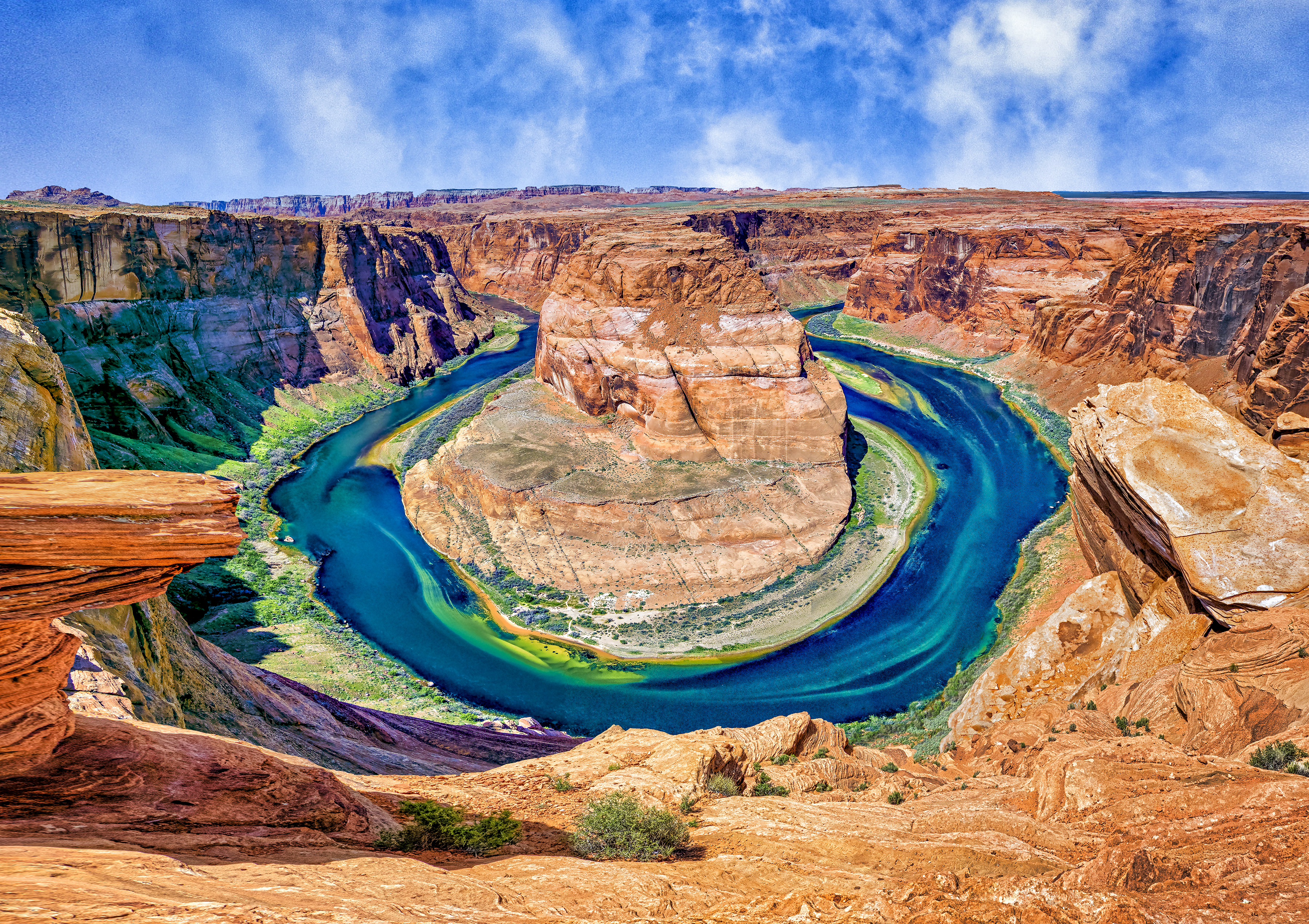 HORSESHOE BEND - A unique bend in the Colorado River near Page, AZ. It’s a 1000 foot drop from the overlook down to the river.