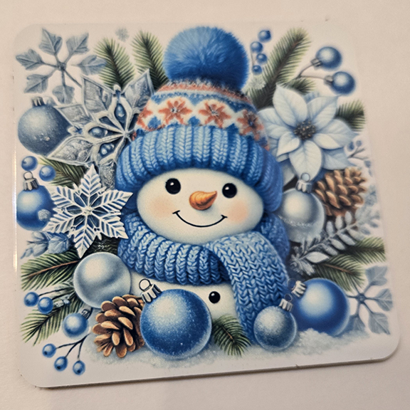 Square metal coaster with a snowman design