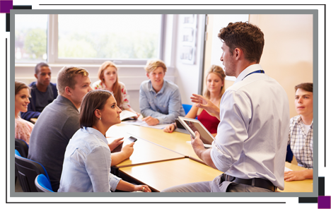 Teacher With College Students Giving Lesson