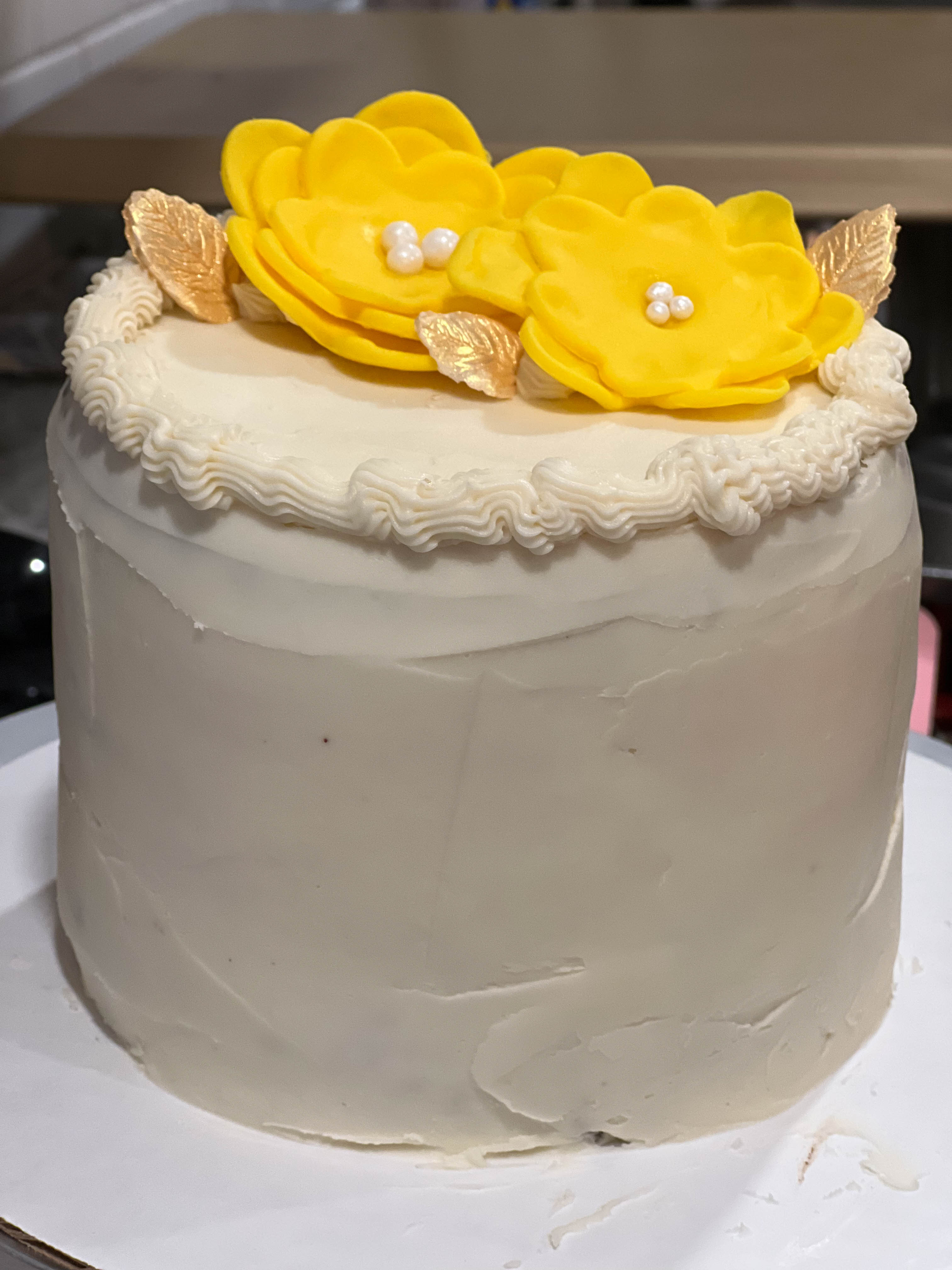 Starting to decorate a cake for Mr.  Chris