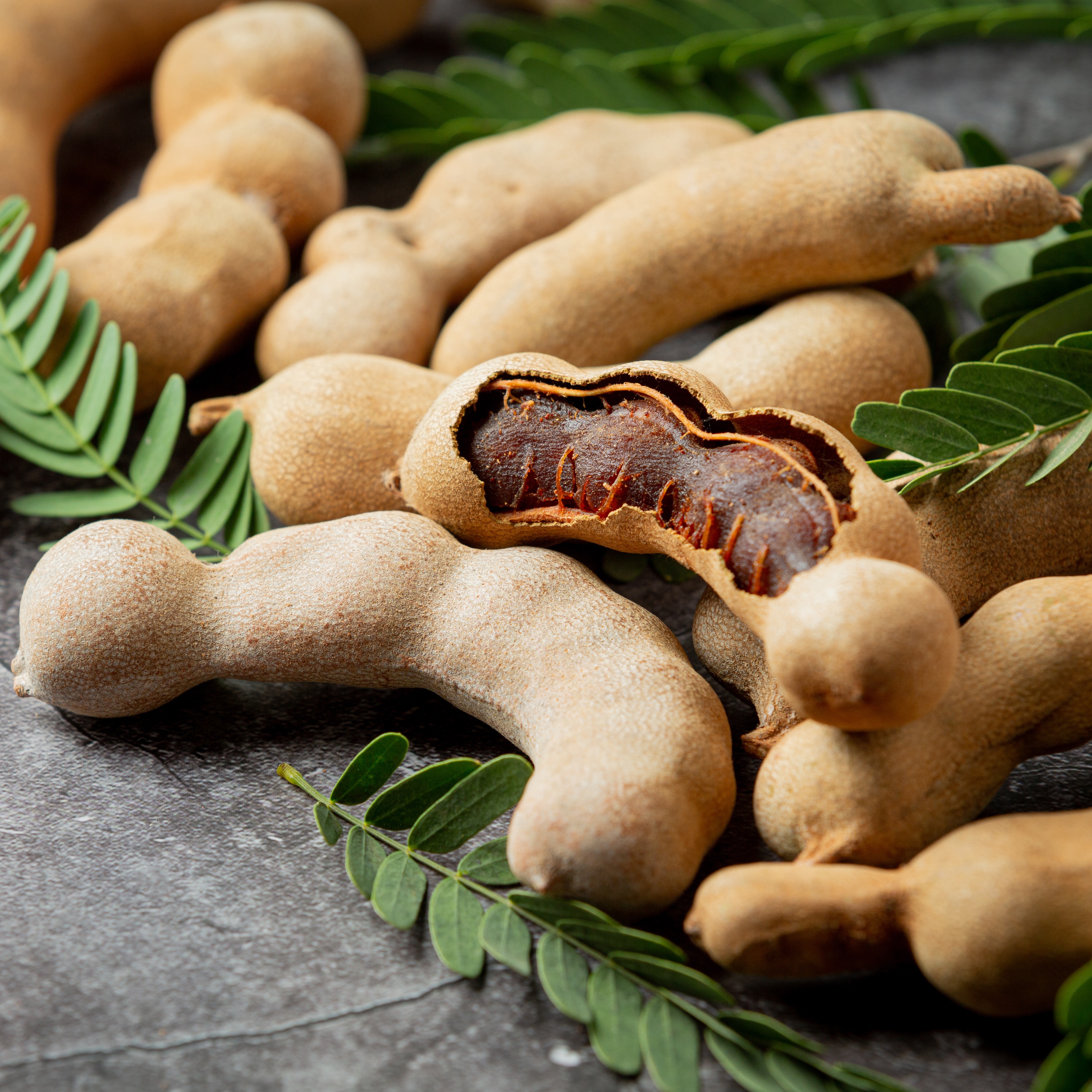 https://0201.nccdn.net/1_2/000/000/13b/7b7/fresh-sweet-ripe-tamarind-dark-surface-1-.jpg