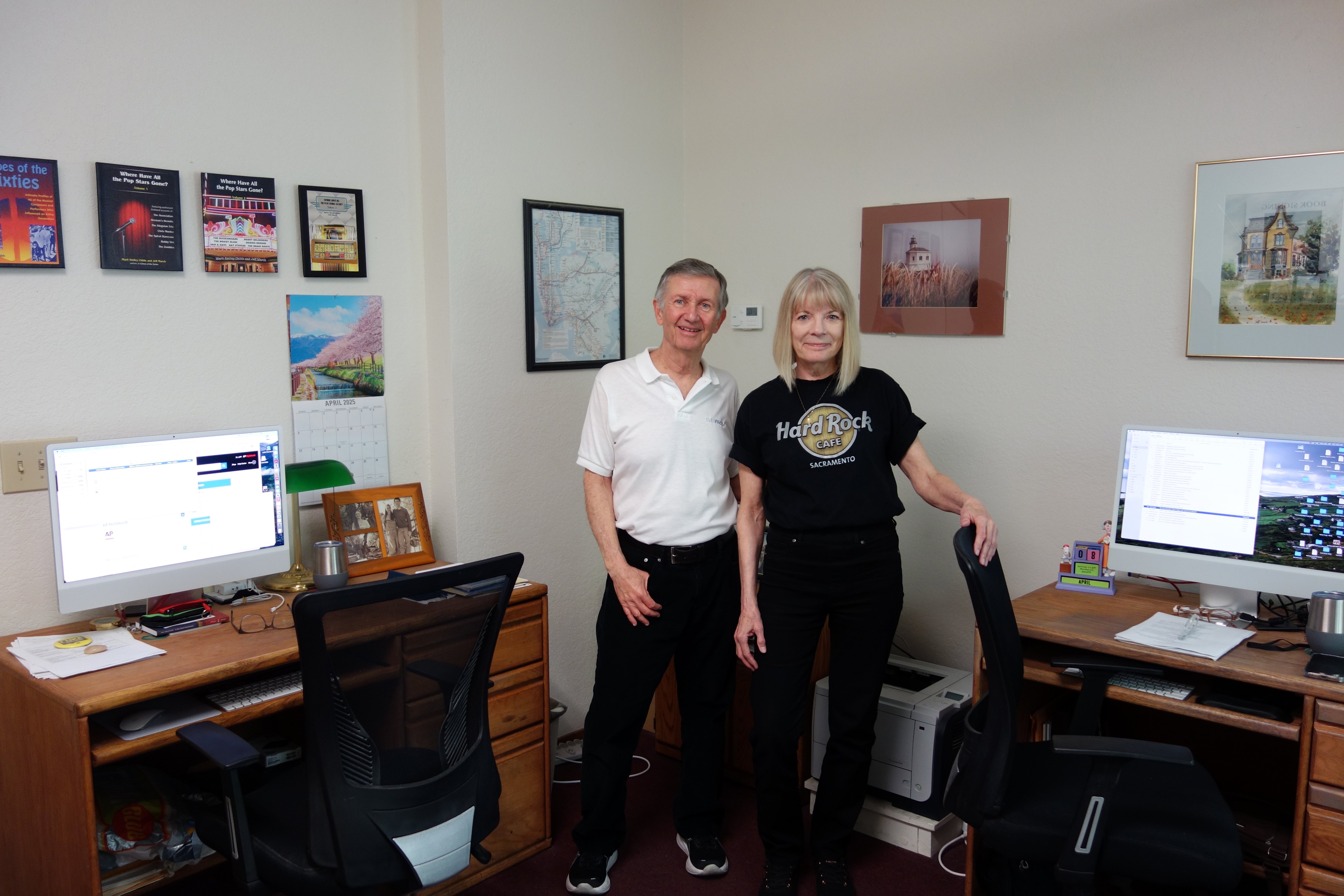 Photo of Jeff March and Marti Childs alongside our desks in the EditPros office in Davis, California.