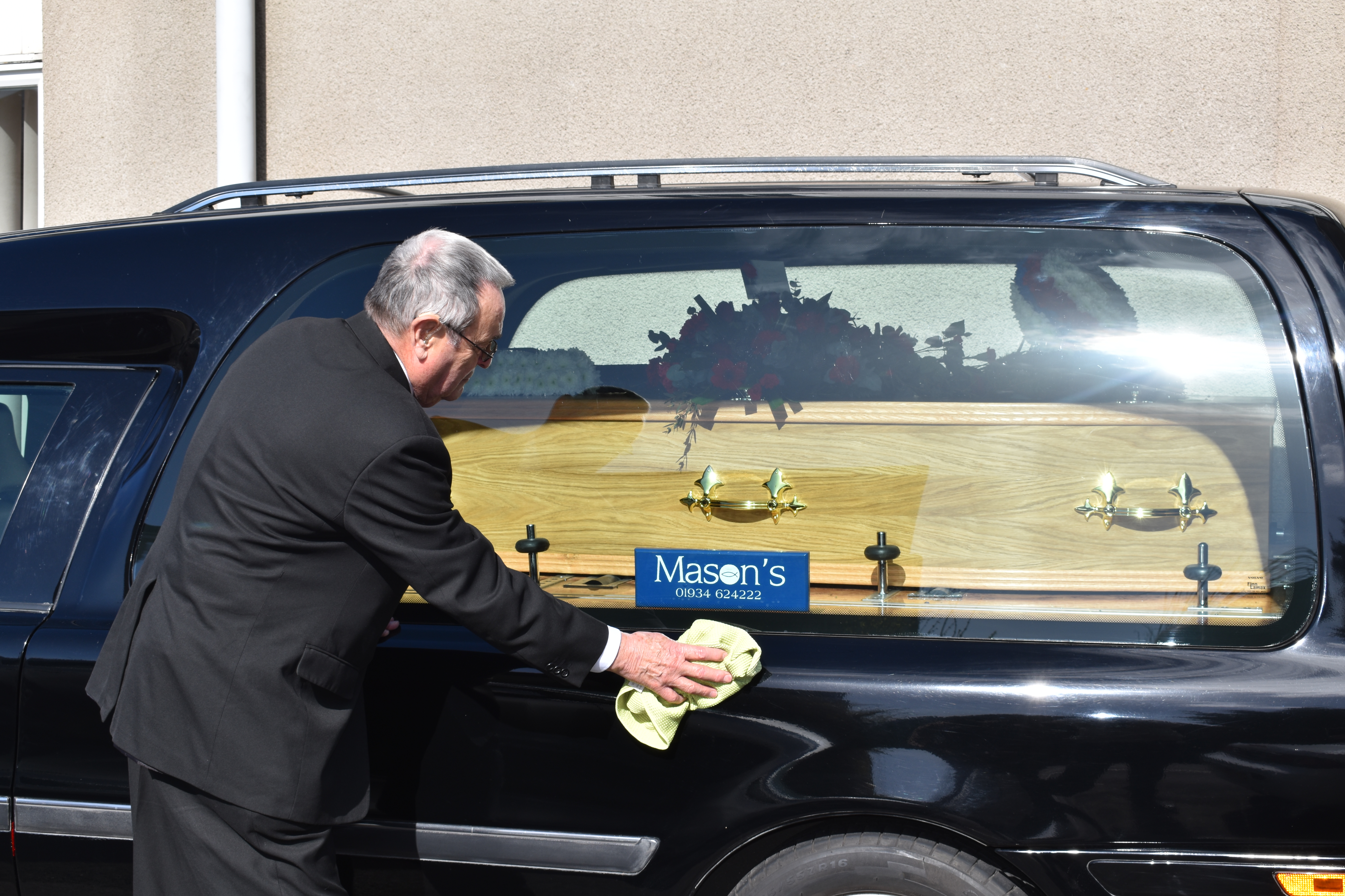 Polishing the hearse.