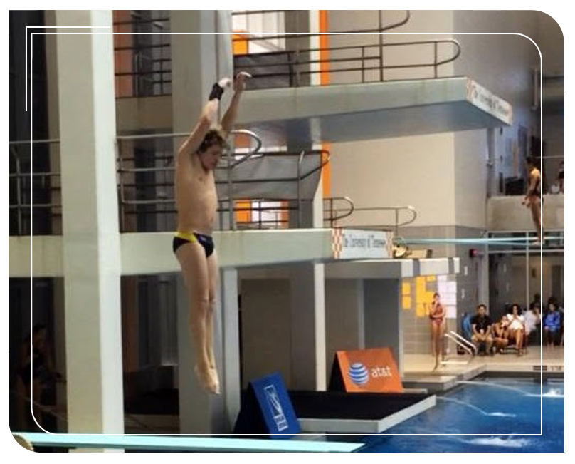 A male preparing to dive into a pool A male preparing to dive into a pool