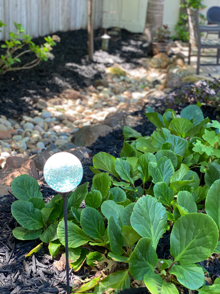CLOSEUP- garden art adds whimsy and shape
