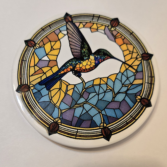 Round ceramic coaster with a stained glass hummingbird desing