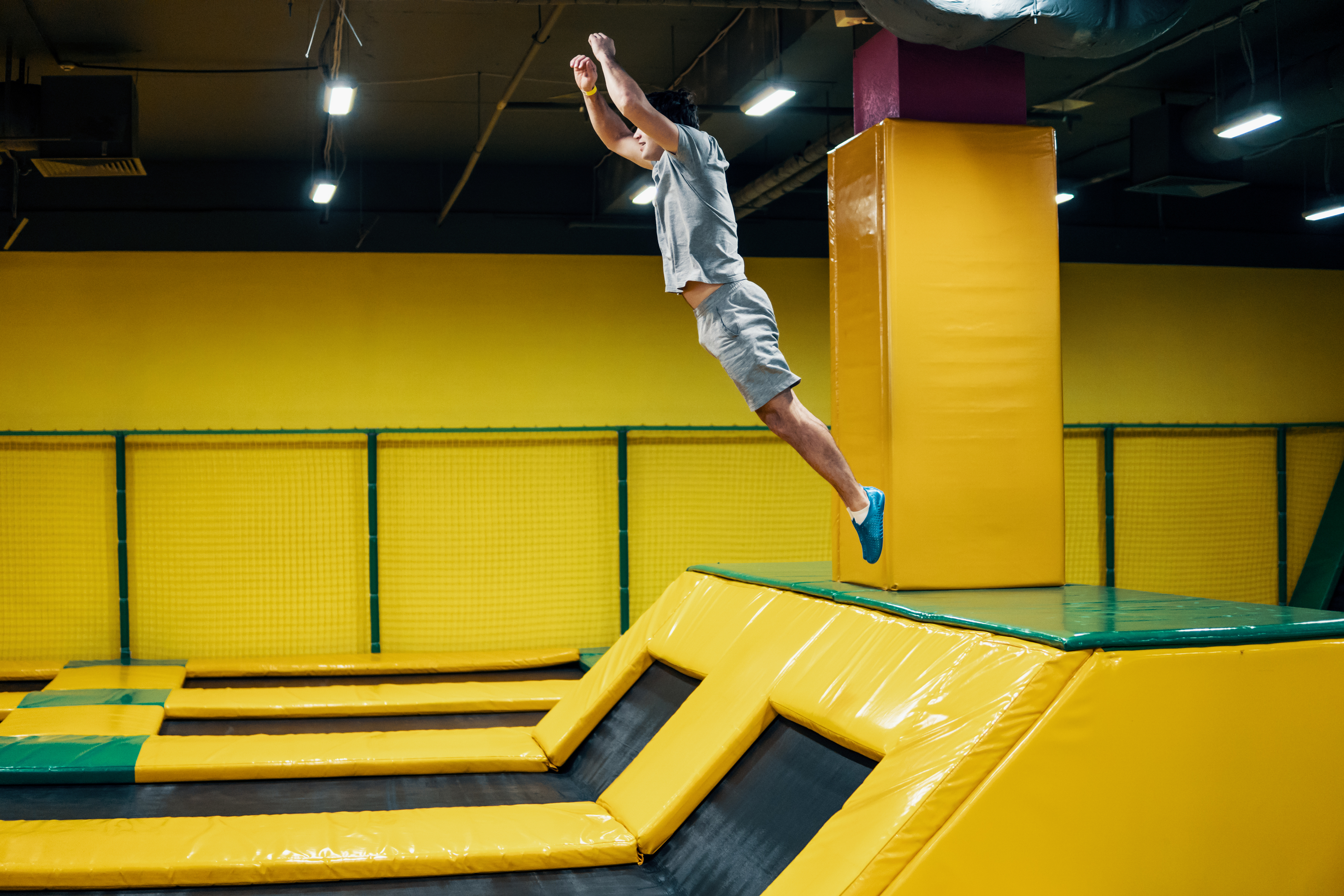 Man in an indoor trampoline park