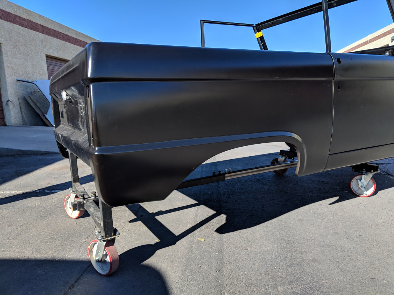 No body seam, between quarter panel and tail light panel