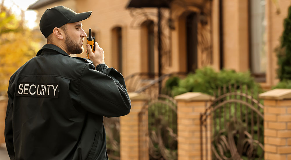 Male Security Guard with Portable Radio Transmitter