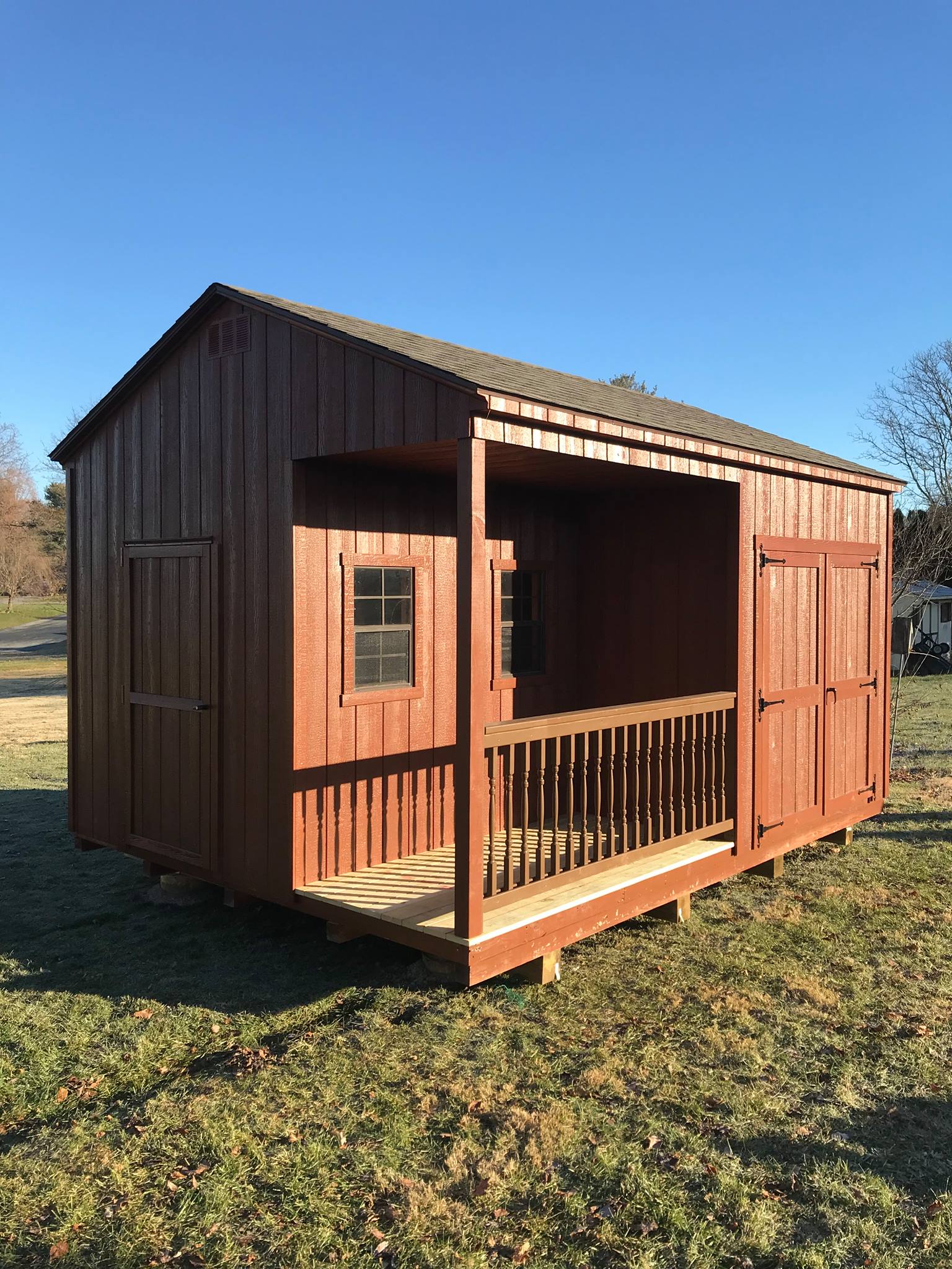 12 x 16 A-Frame In Wood 
                                                      Featuring mahogany stained wood siding, mahogany stained trim, and weatherwood shingles. 8’ sidewalls, upgraded to New England Doors, deluxe hinges, 1- 3’ mahogany stained door, 4x8’ porch wood decking , 1- 4x4 treated post , 8’ chestnut colored wooden railing